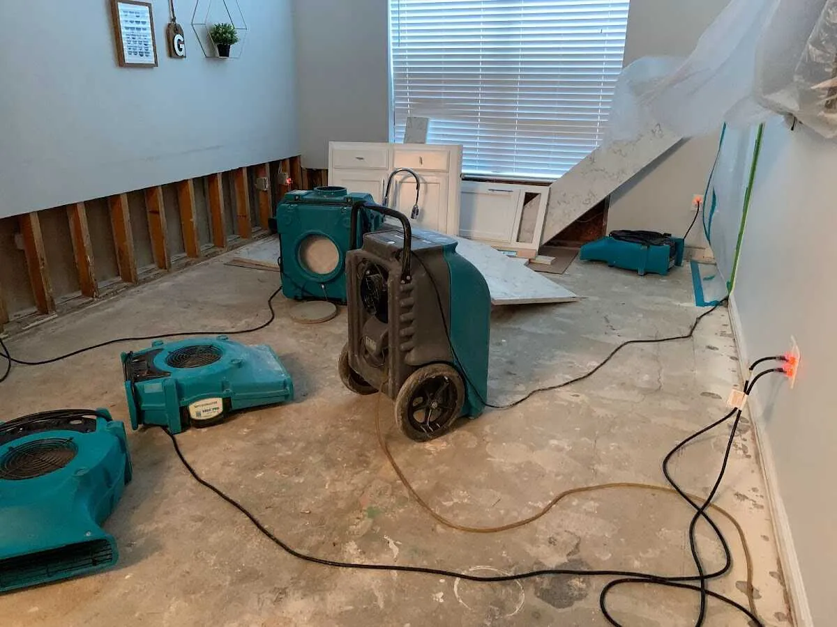 Dehumidifier in flood-cut room for Water Damage Restoration in Ayden